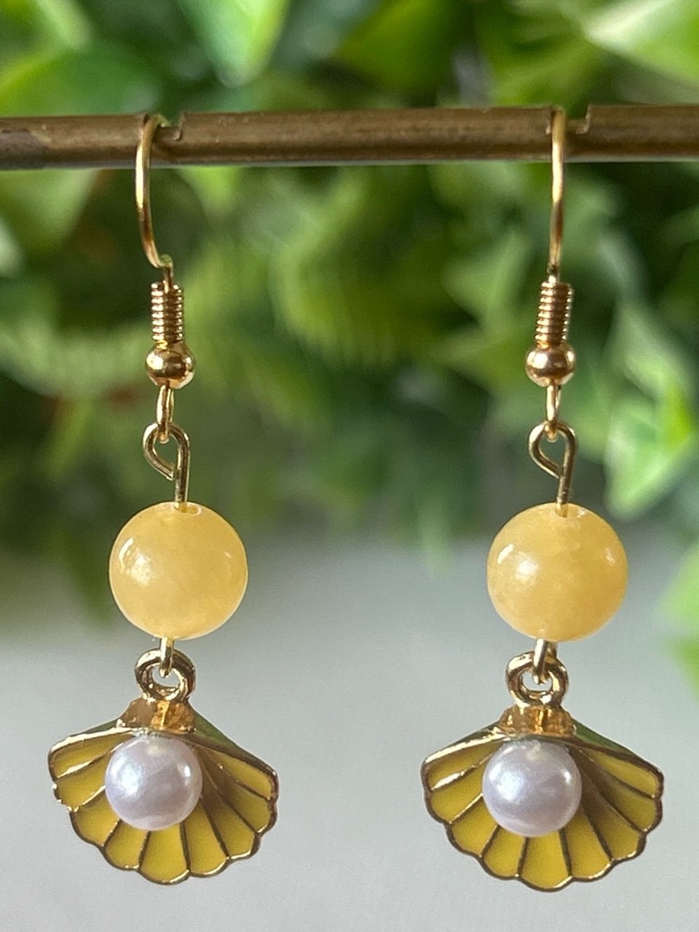 Handmade yellow calcite shell earrings with faux pearl detail